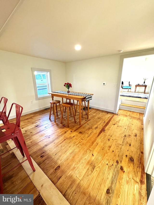 dining area with light hardwood / wood-style flooring