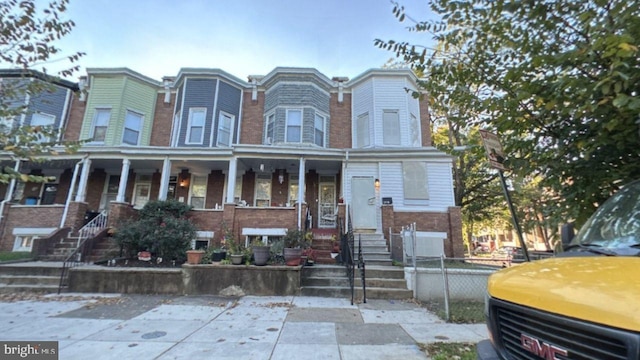 multi unit property featuring a porch