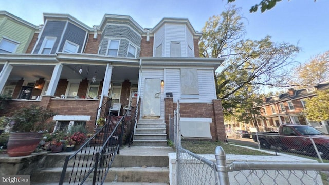 view of property with a porch