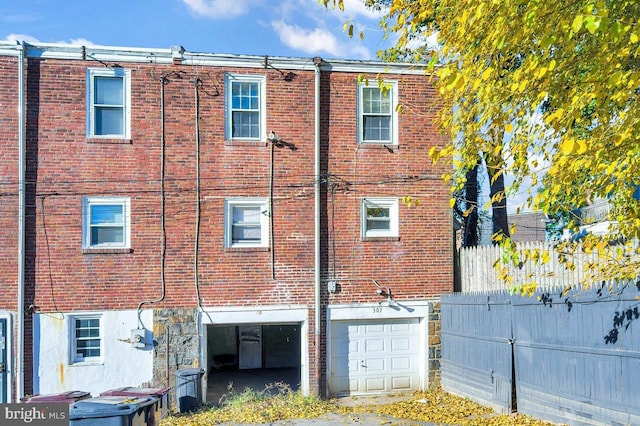 back of house with a garage