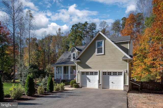 view of front of property with a garage and covered porch