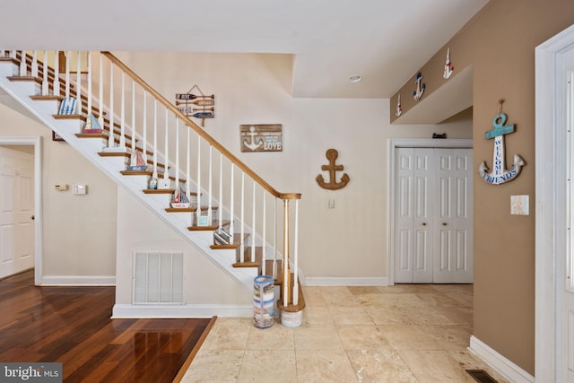 entryway with hardwood / wood-style floors