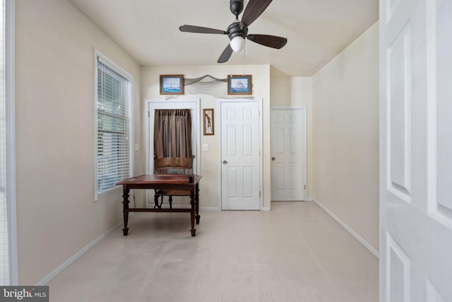 interior space featuring ceiling fan