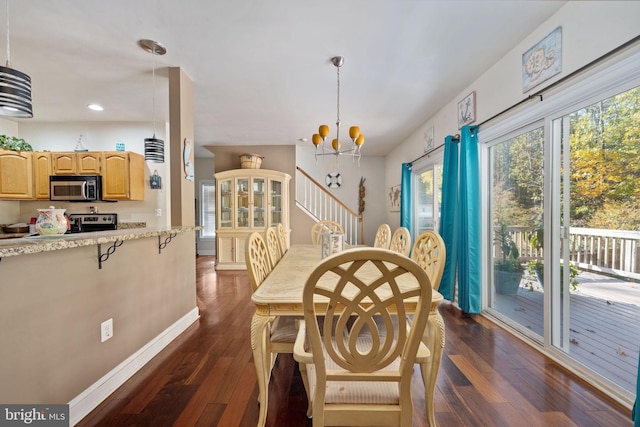 dining room featuring dark hardwood / wood-style flooring and a chandelier