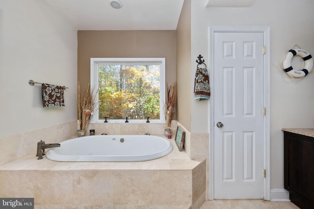 bathroom featuring tiled tub