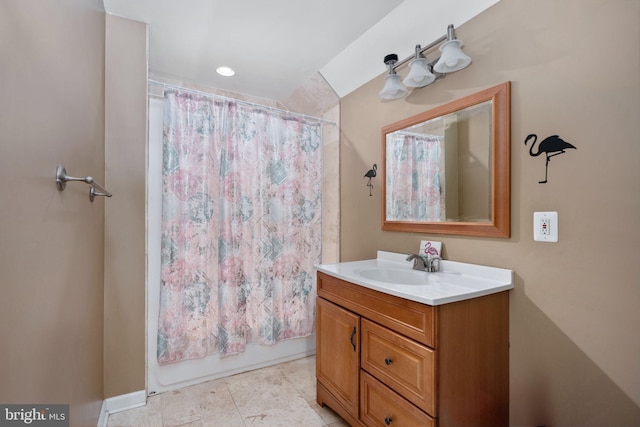 bathroom featuring shower / tub combo with curtain and vanity