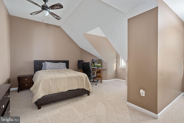 bedroom featuring ceiling fan, vaulted ceiling, and carpet