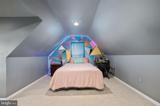 carpeted bedroom featuring vaulted ceiling