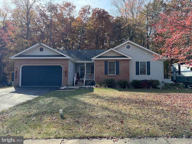 single story home featuring a front yard and a garage