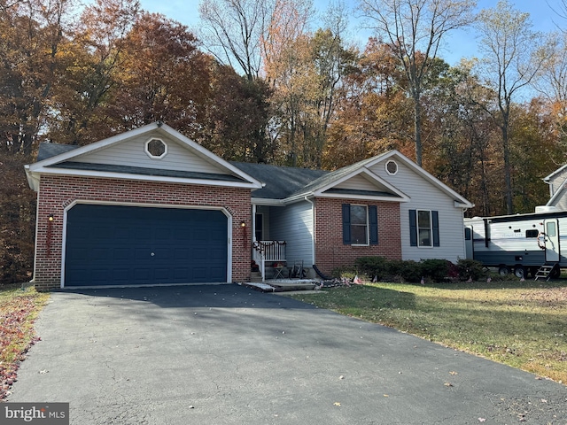 single story home with a front yard and a garage