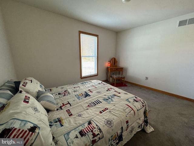 bedroom with dark carpet