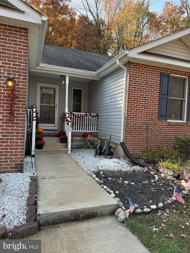 property entrance with covered porch