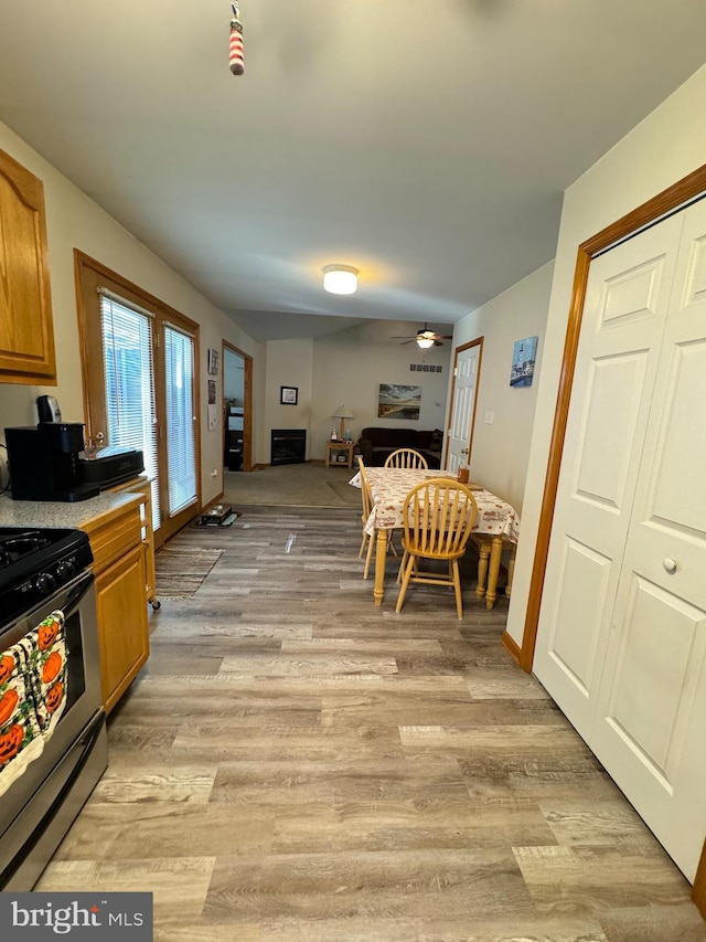 dining area featuring ceiling fan and light hardwood / wood-style flooring