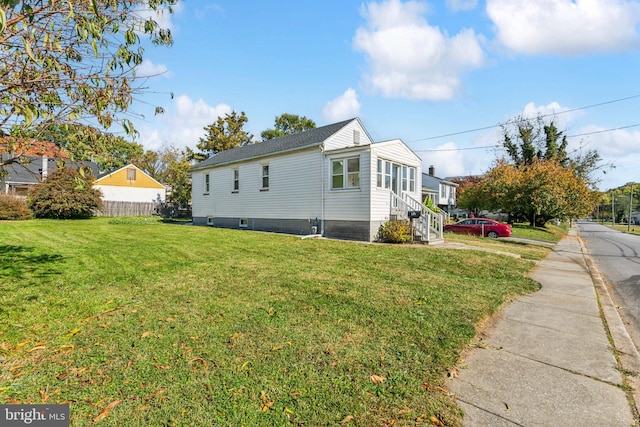 view of property exterior featuring a yard