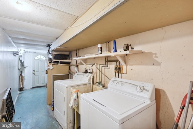 laundry room with washing machine and clothes dryer