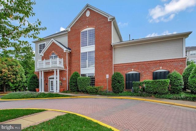 front of property with a balcony