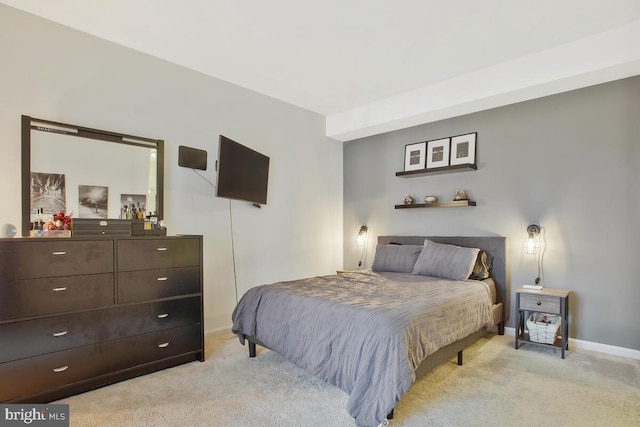 bedroom with light carpet