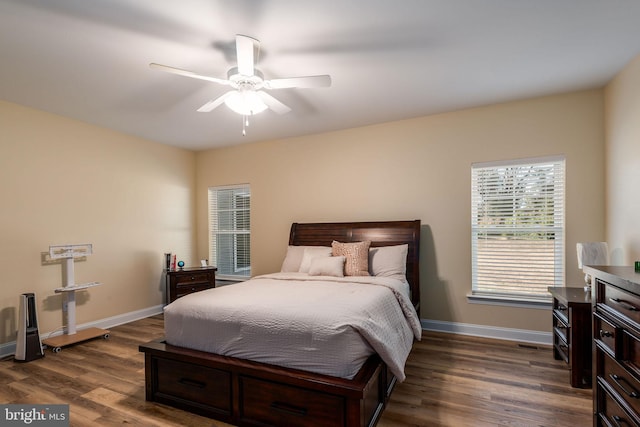 bedroom with dark wood-type flooring and ceiling fan