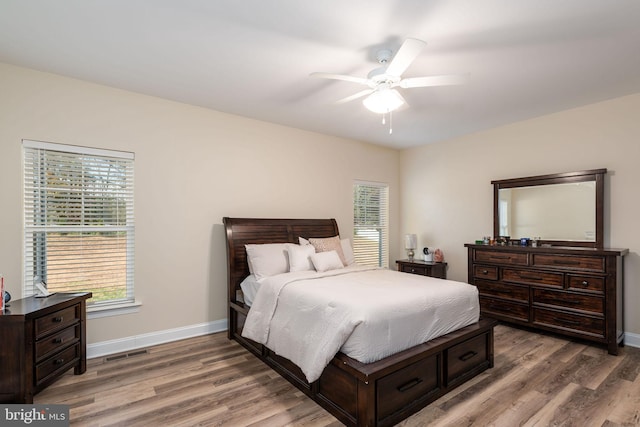 bedroom with hardwood / wood-style flooring and ceiling fan