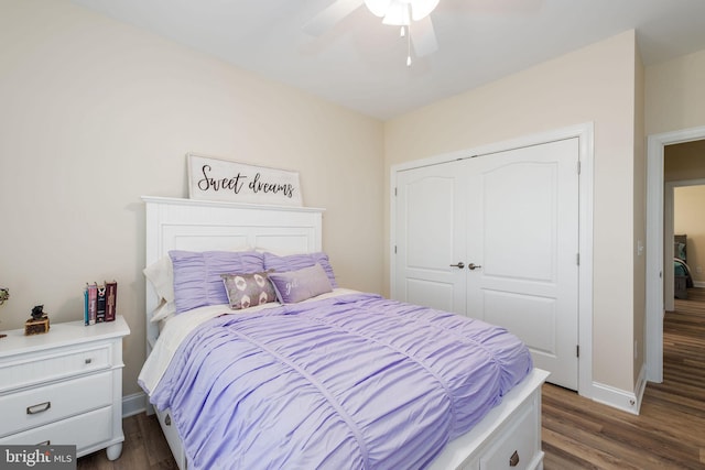 bedroom featuring a closet, dark wood-type flooring, and ceiling fan