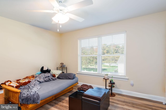 bedroom with light wood-type flooring and ceiling fan