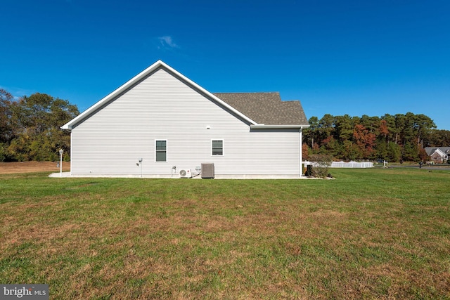 view of home's exterior with a yard and central air condition unit