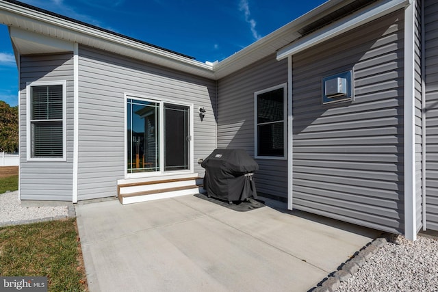 view of patio with a grill