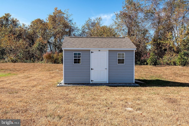 view of outdoor structure with a lawn