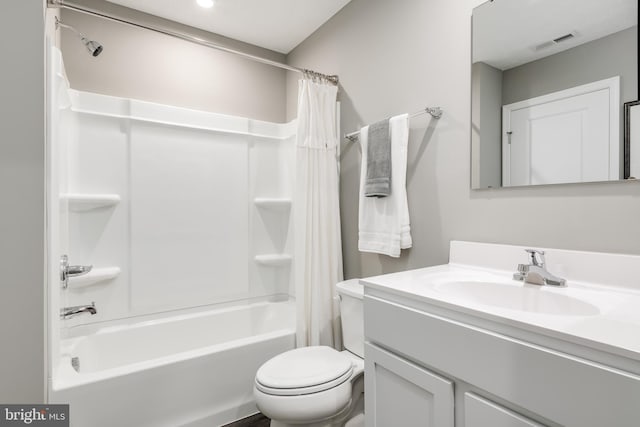 full bathroom with shower / tub combo, vanity, and toilet