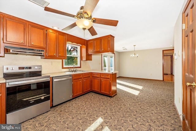 kitchen featuring hanging light fixtures, sink, light colored carpet, appliances with stainless steel finishes, and ceiling fan with notable chandelier