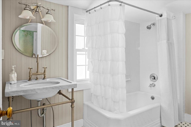 full bathroom featuring shower / tub combo and a wealth of natural light