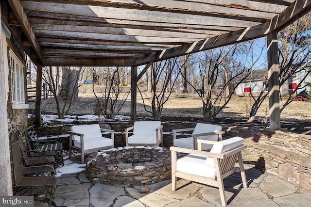 view of patio featuring an outdoor fire pit and a pergola