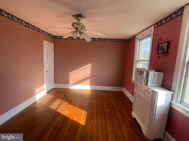 unfurnished dining area with ceiling fan and dark hardwood / wood-style floors