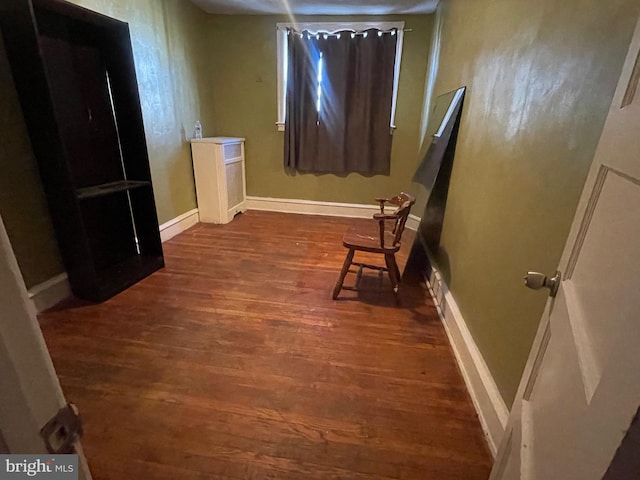 hallway featuring dark hardwood / wood-style flooring