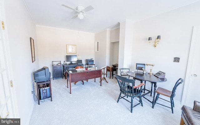 office area with light colored carpet, ceiling fan, and crown molding