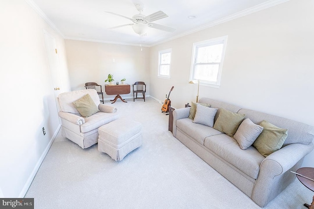 carpeted living room with ceiling fan and ornamental molding