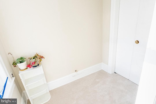 unfurnished bedroom featuring light colored carpet