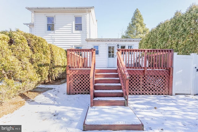 rear view of property with a wooden deck