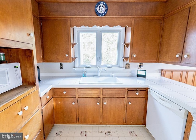 kitchen with white appliances and sink