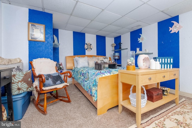 carpeted bedroom featuring a paneled ceiling