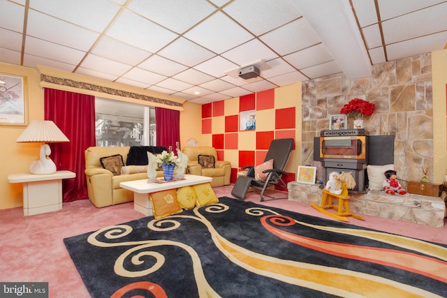 living room featuring a paneled ceiling and carpet floors