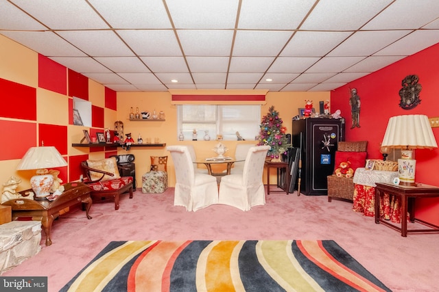 recreation room with carpet flooring and a drop ceiling