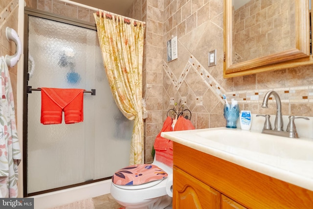 bathroom featuring tile patterned flooring, vanity, curtained shower, and toilet