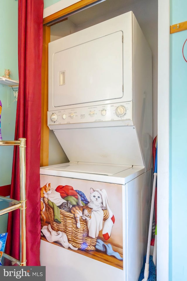 laundry area featuring stacked washer and dryer