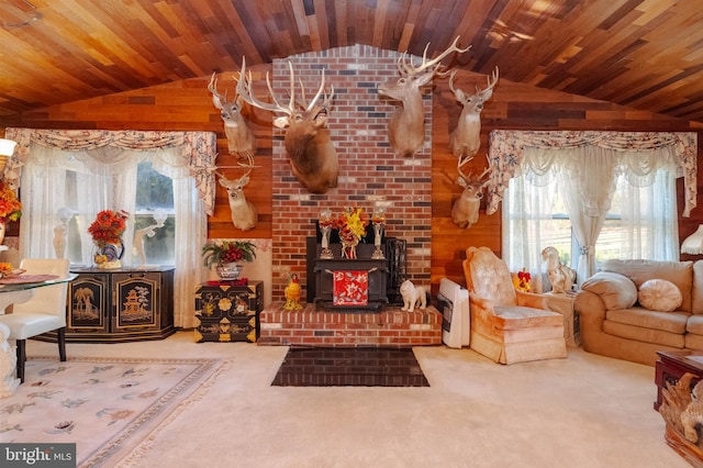 living room featuring wood walls, a wealth of natural light, wooden ceiling, and carpet floors