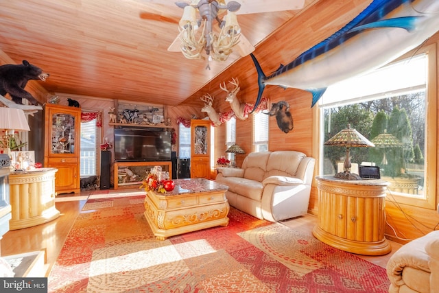 living room with wood walls, light wood-type flooring, wood ceiling, and lofted ceiling