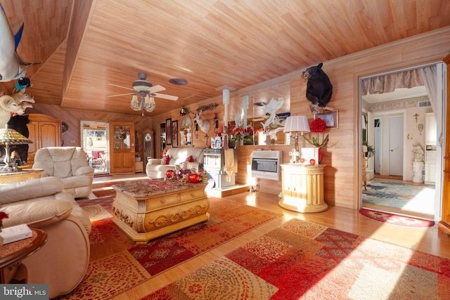 living room with light wood-type flooring, wooden walls, ceiling fan, and wooden ceiling