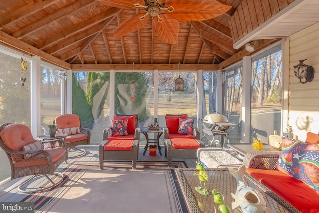 sunroom featuring wooden ceiling, ceiling fan, and vaulted ceiling with beams