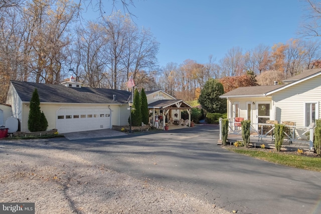 view of front of home with a garage and covered porch