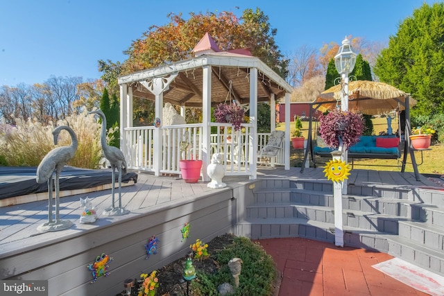 wooden deck featuring a gazebo